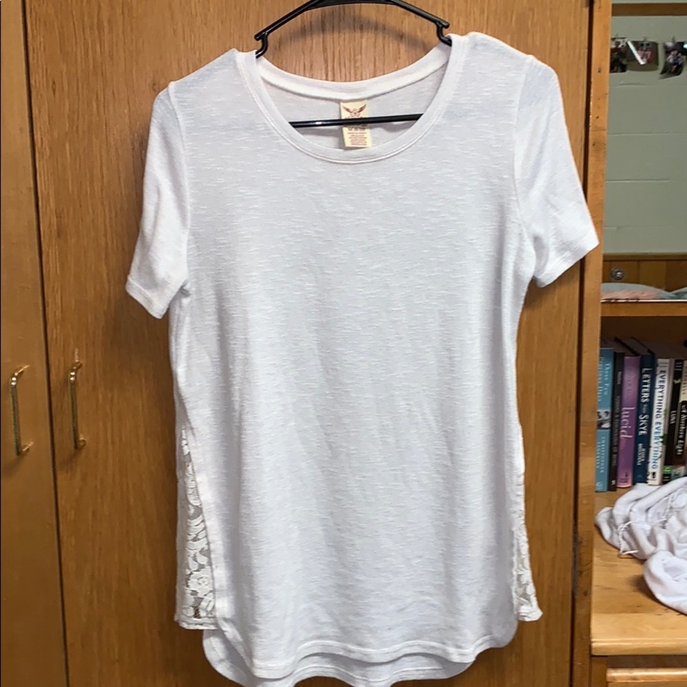 White Womens top. Size M. Lacey sides.